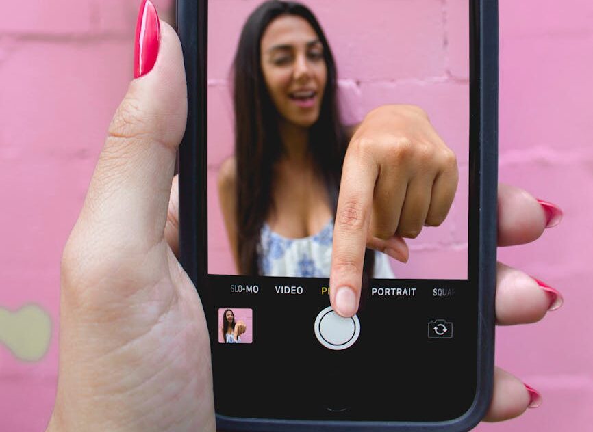 photo of person holding iphone